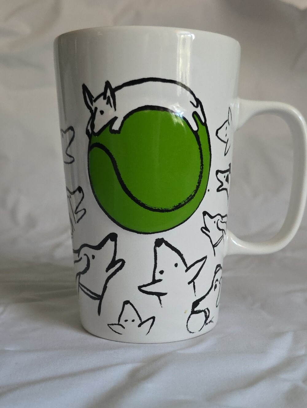 This is a 2015 Starbucks ceramic  16 Oz coffee mug featuring a doodle dogs